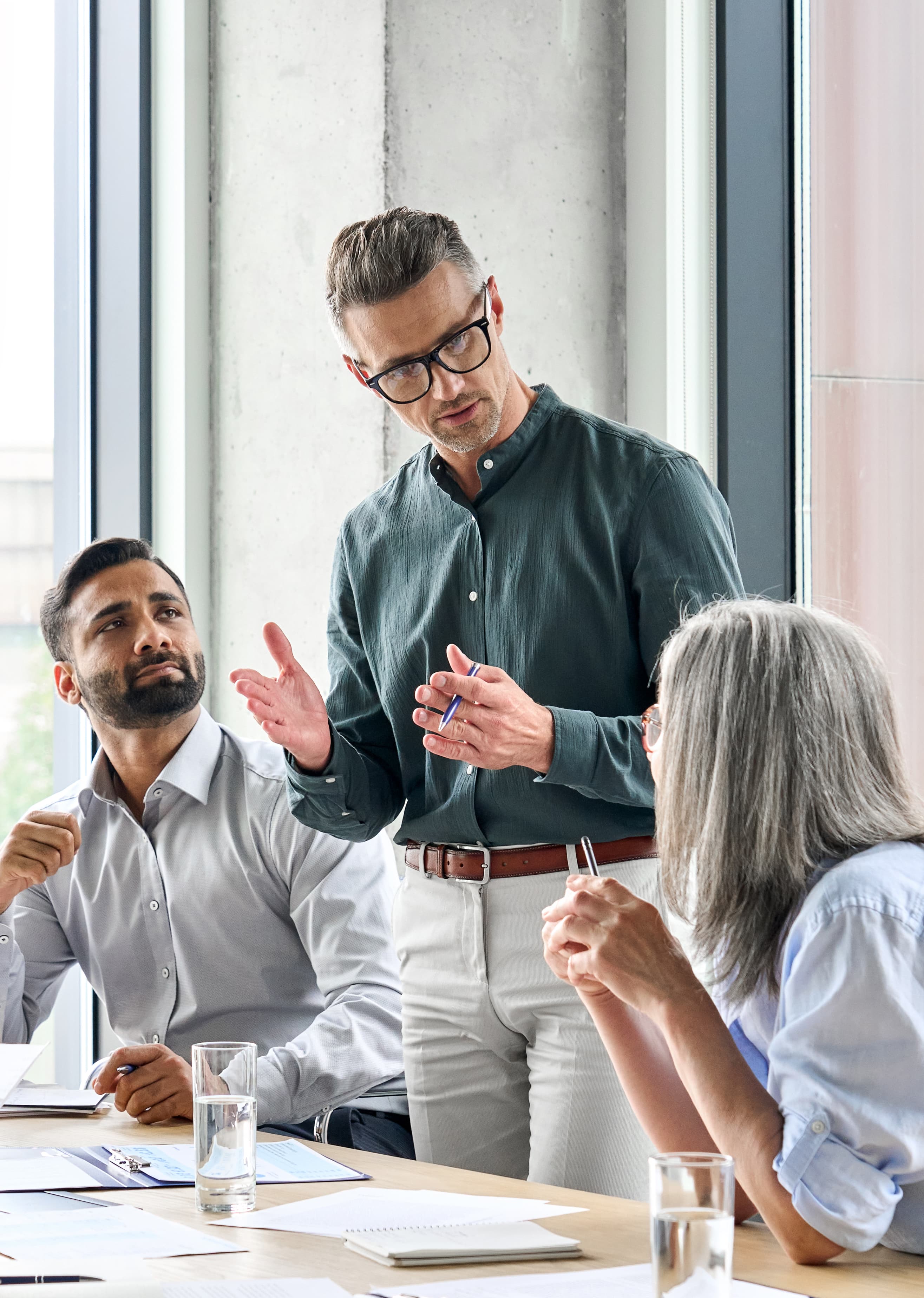 Two diverse male leaders in discussion